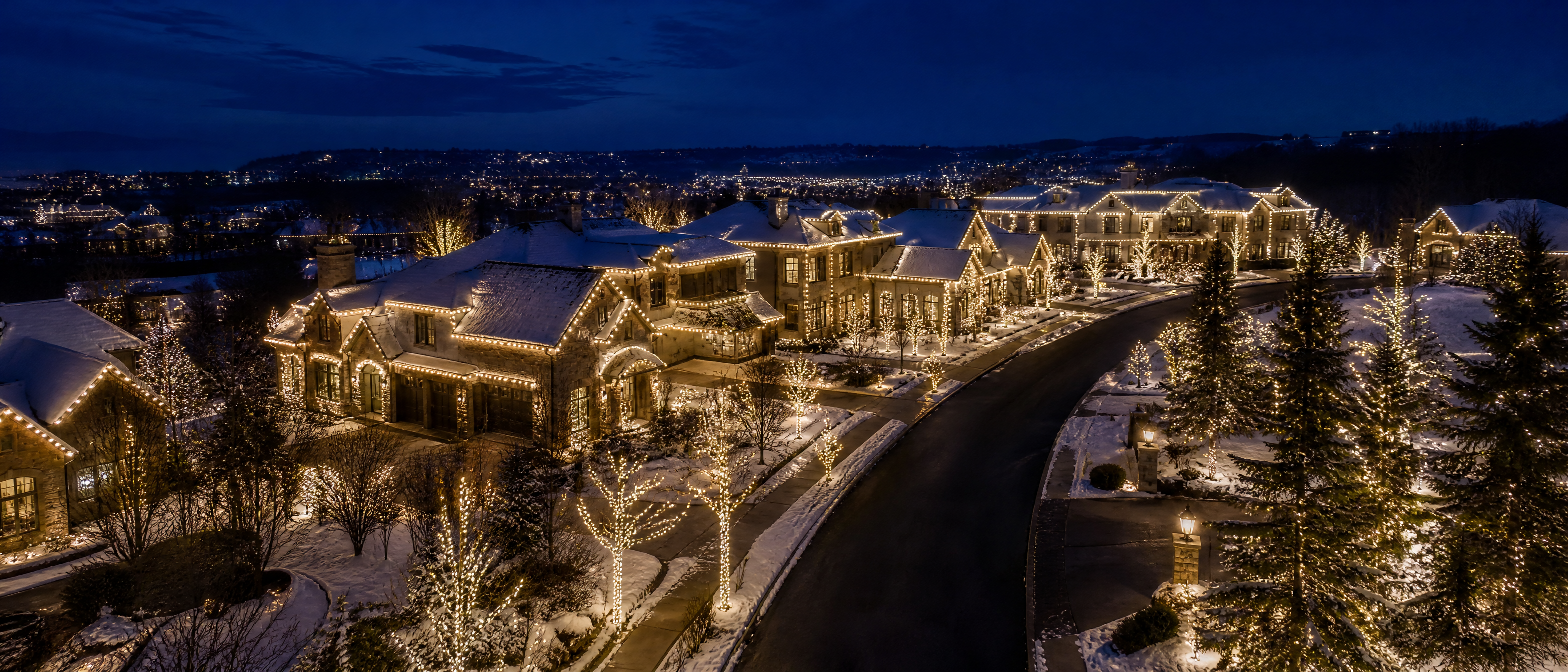 Street of homes lit in warm white